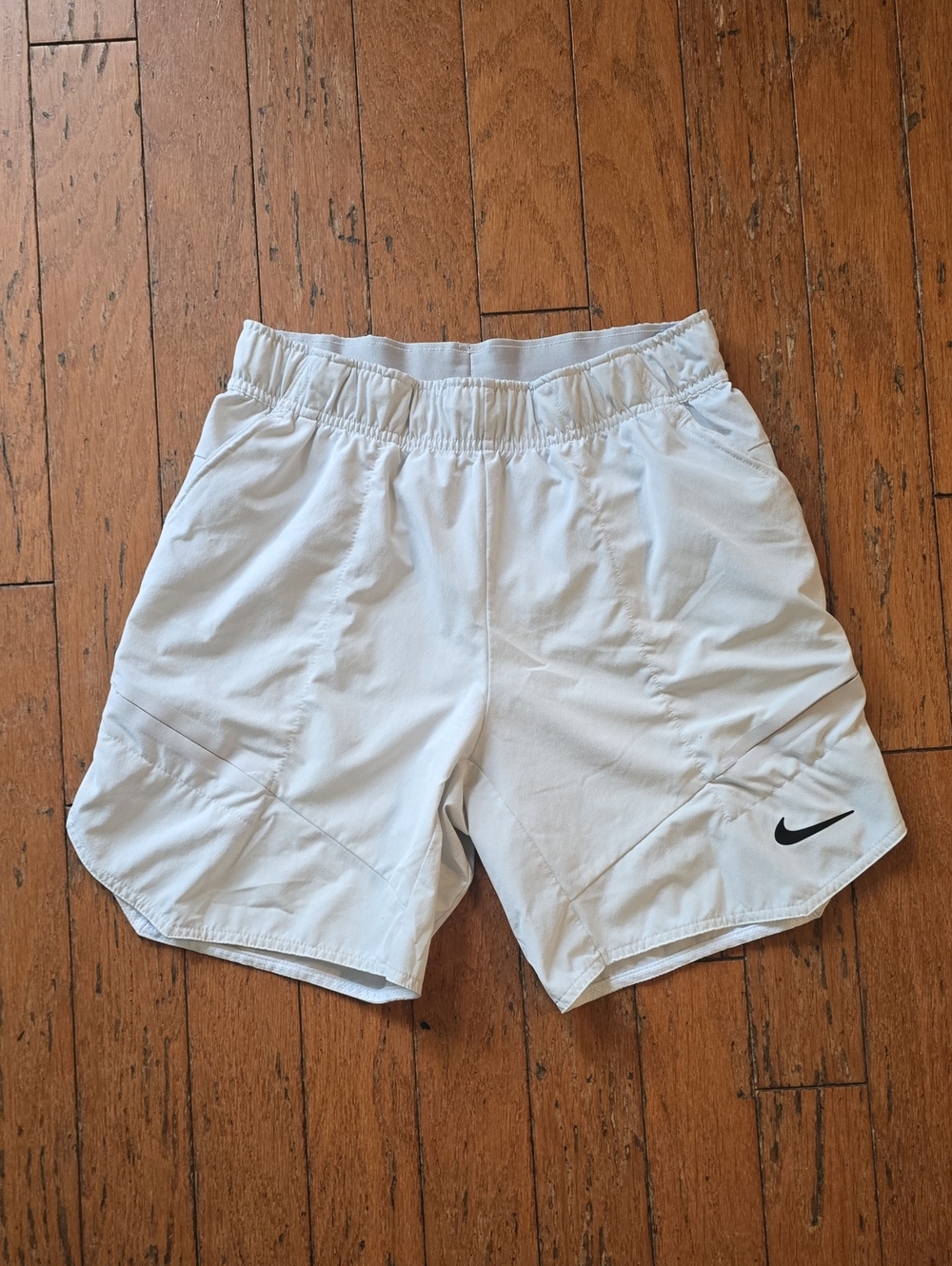 Nike White Athletic Shorts with Black Swoosh